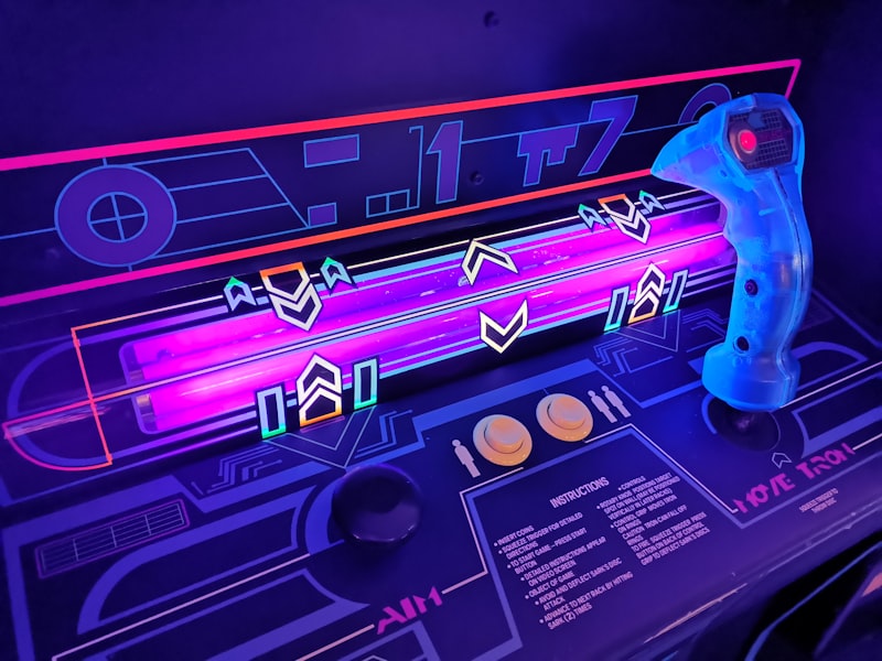 Row of glowing fighting-game cabinets