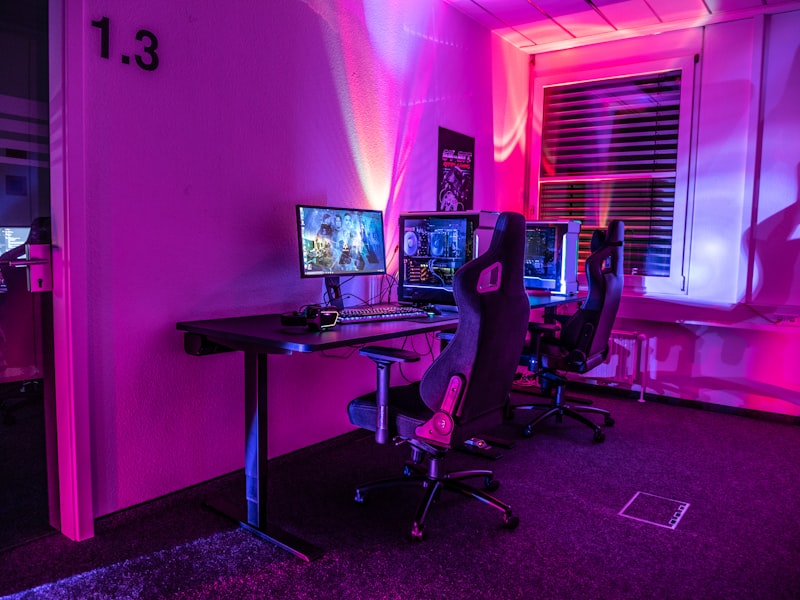 Retro pinball machines under pink light